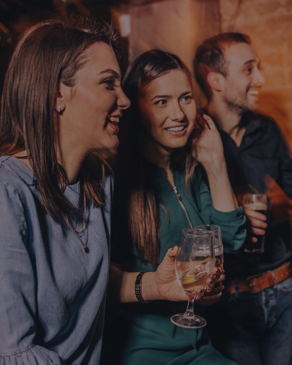 Friends chatting at a bar