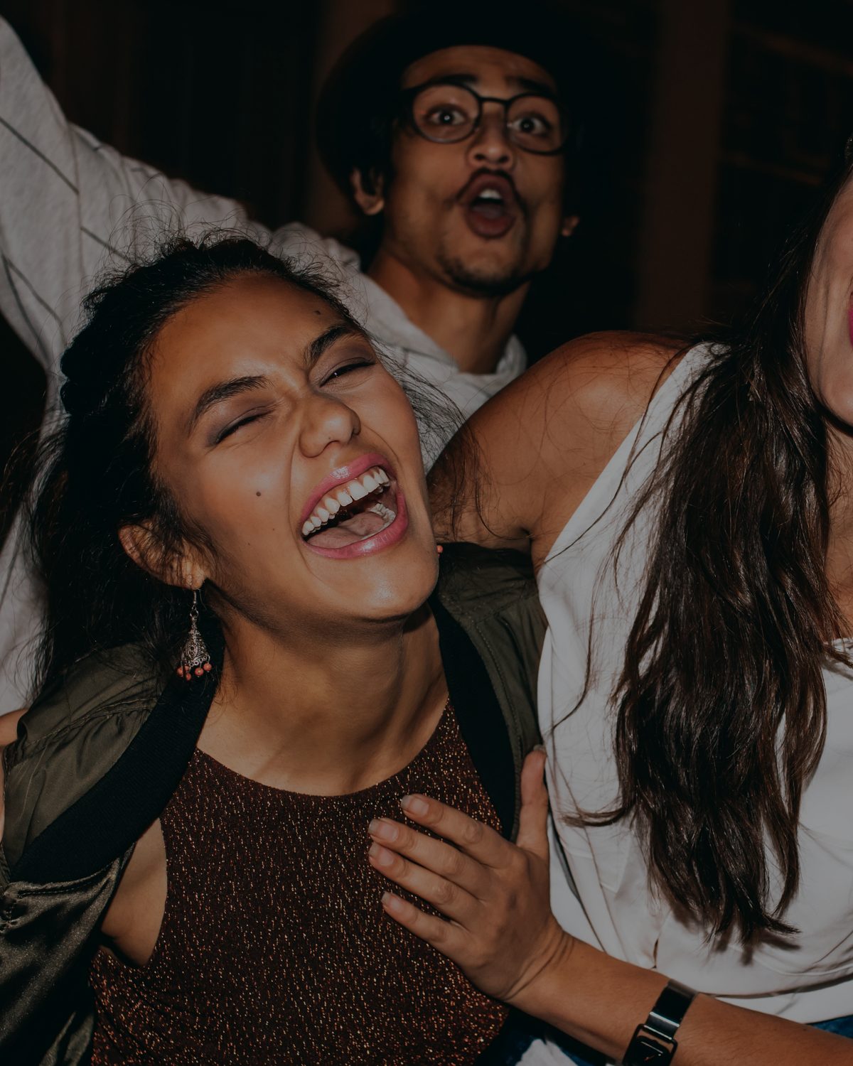Friends laughing together on a night out