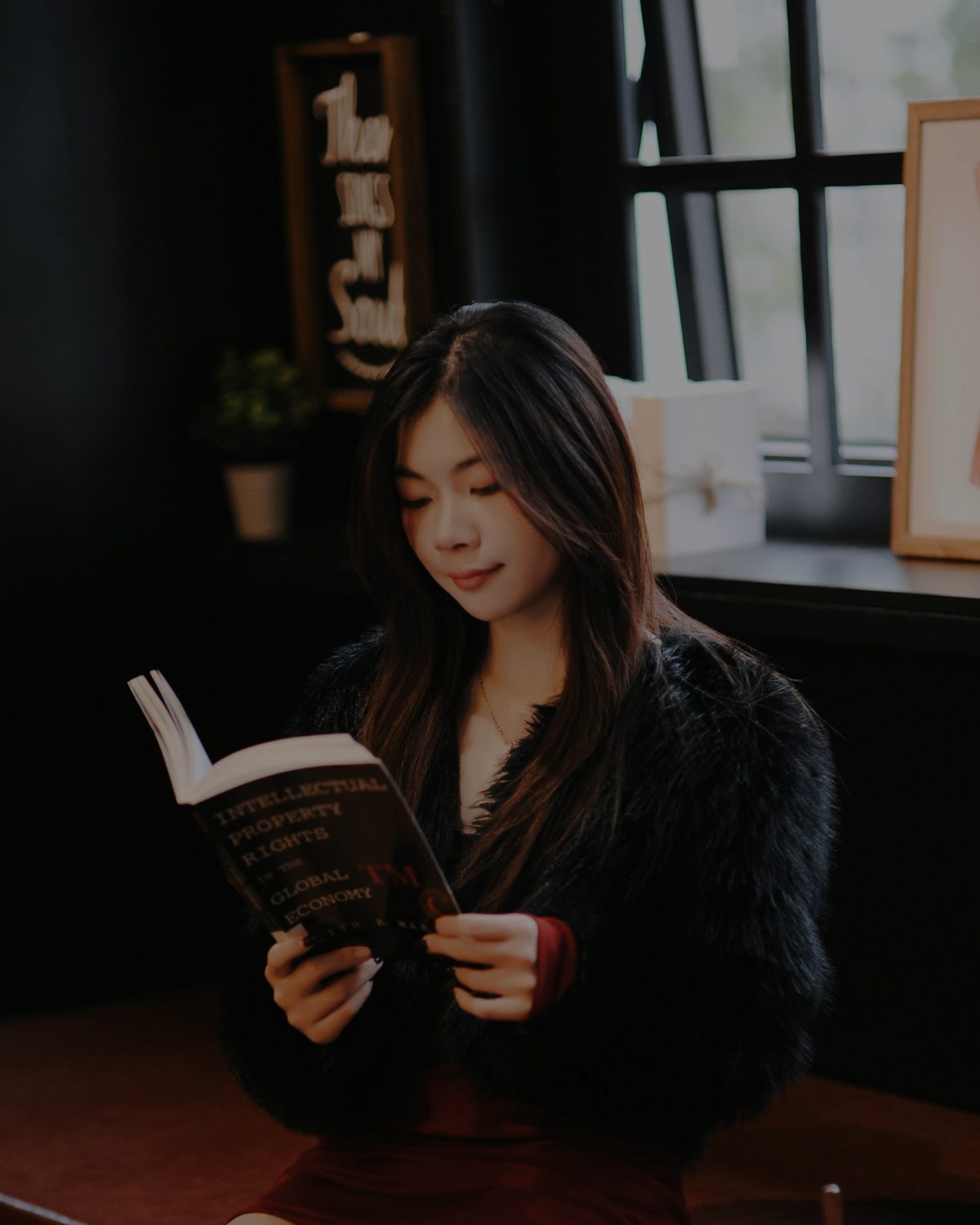 A woman reading in a cosy corner